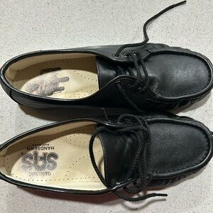 New black leather shoes .